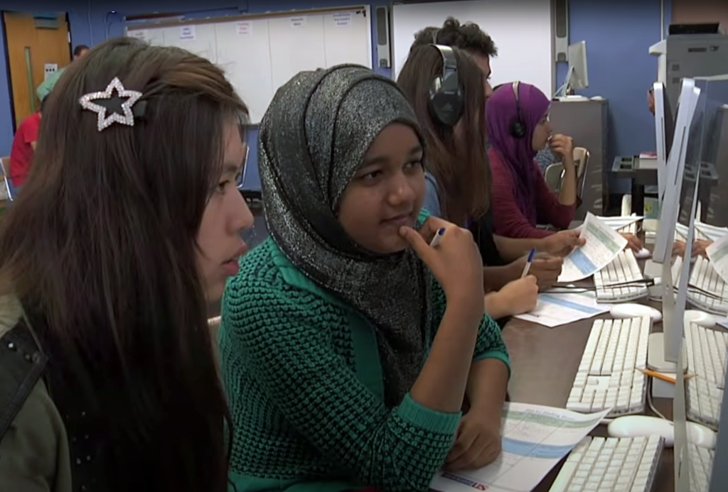 Students at collaborating at a computer.